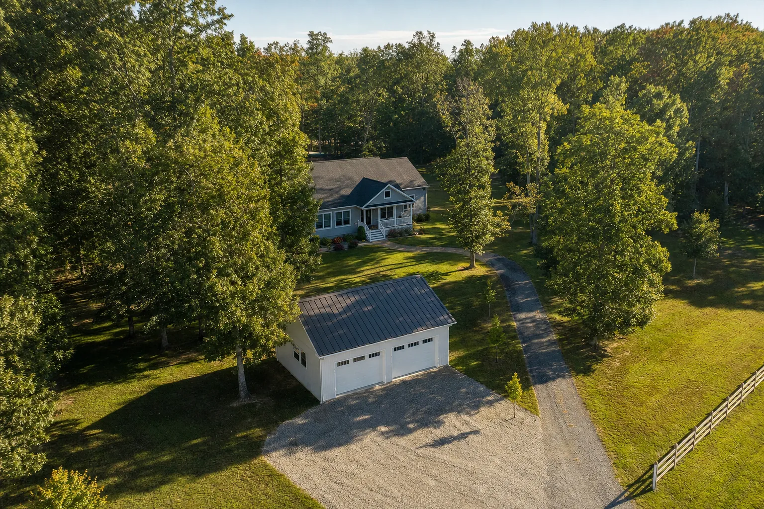 Garage and home on a wooded Southern Maryland property